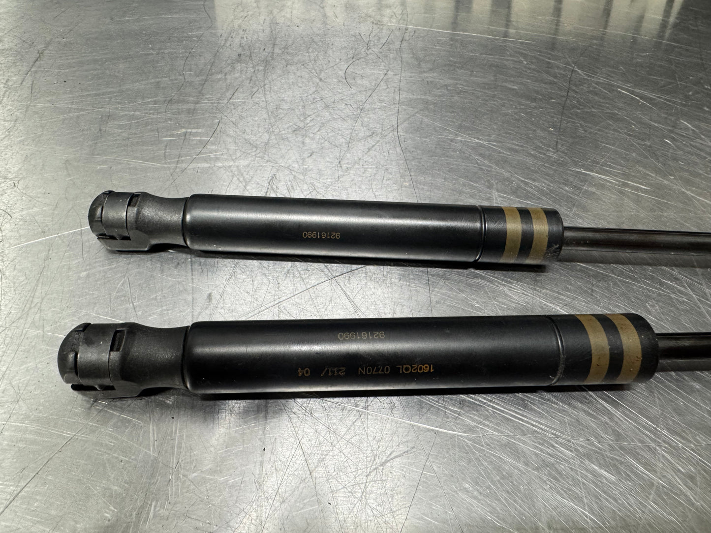 04-06 PONTIAC GTO REAR TRUNK SHOCK STRUTS OEM #L447